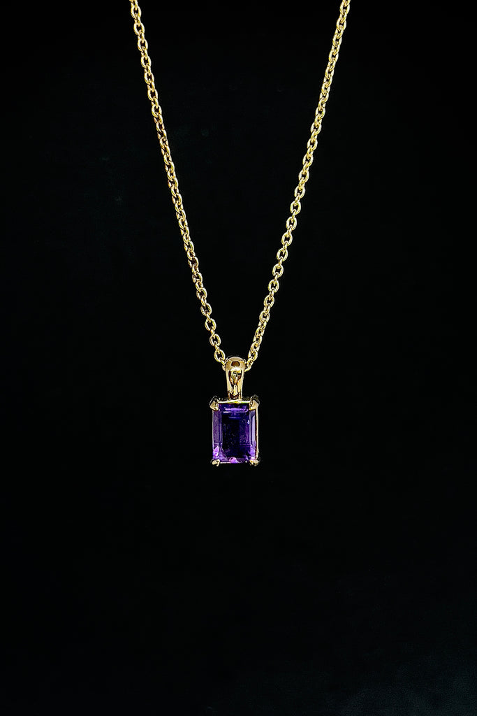 The pendant and chain are 9ct gold vermeil on a base of 925 silver, the gold is 2.5microns thick so will never rub or discolor An Amethyst emerald cut gemstone set in 9ct gold vermeil. Pendant is 4cm long. Chain is gold vermeil