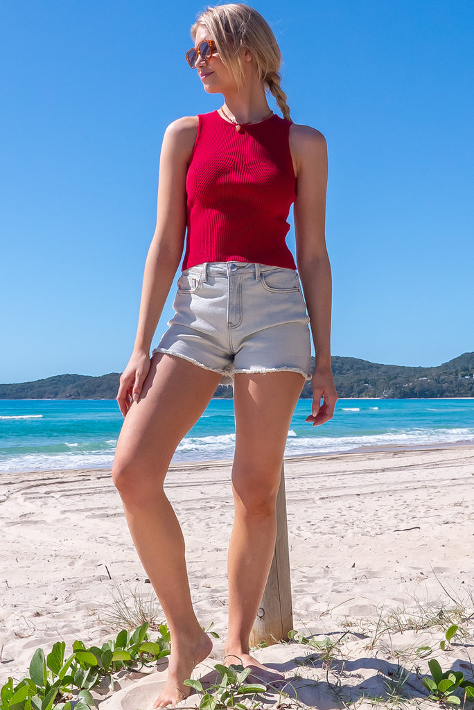 The Astro Really Red Knit Tank Top is a luxurious berry red tank top. The tank top features a high neck, stretchy knit fabric, ribbed texture and is fitted.