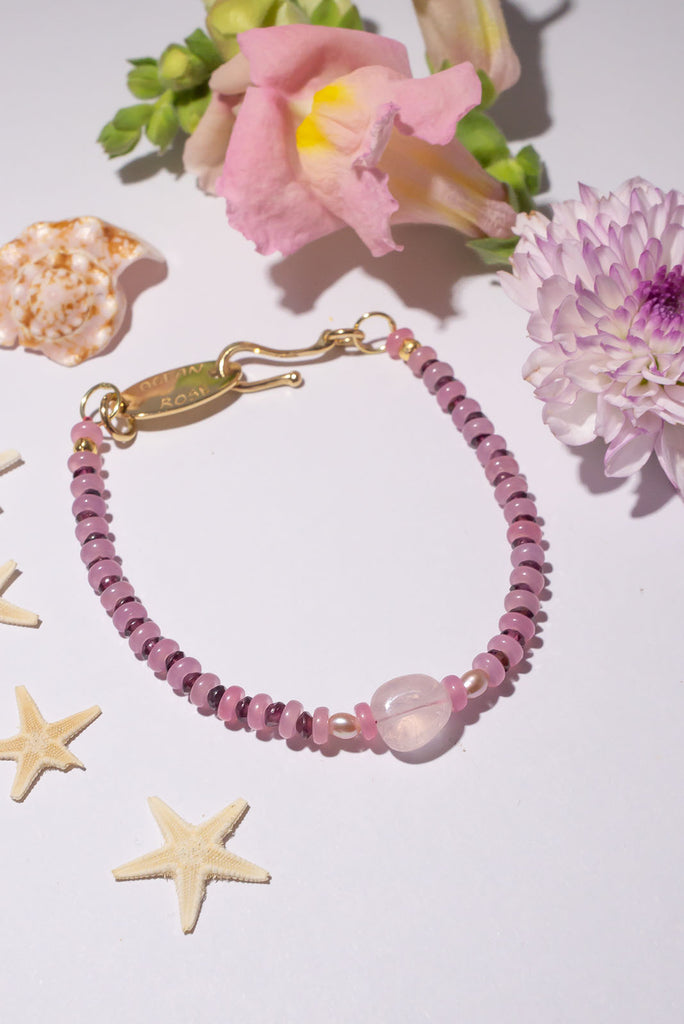 Rose quartz, pink quartz, pink pearls and rhodolite garnet bracelet. Very pretty and feminine. Dainty and rounded in style. 