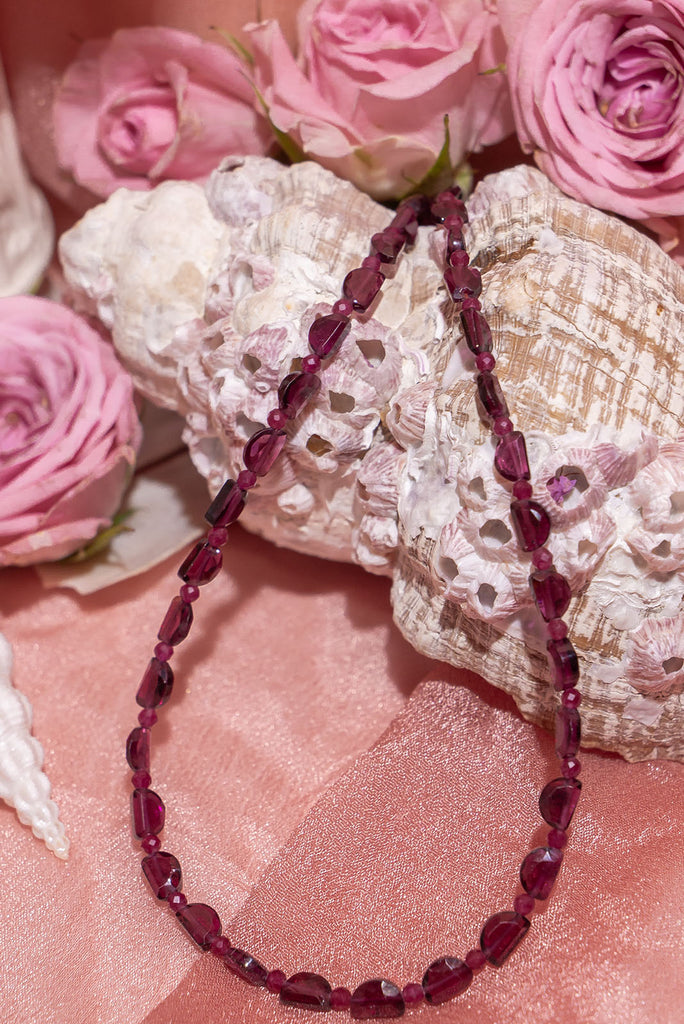 Choker style Cerise Entangled Necklace showcasing beaded Garnet, Rhodolite Garnet, Treated Pink Ruby, Treated Ruby, and Pink Tourmaline with gold vermeil findings.