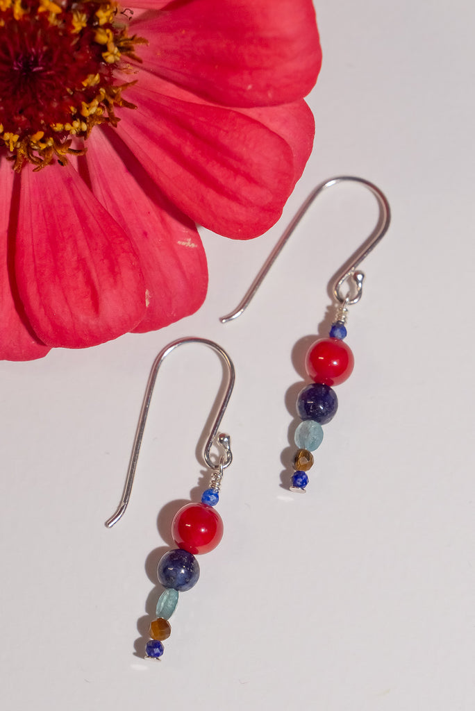 A dainty tower of bold bright colours. Featuring beautiful blue lapis lazuli and bold red coral.&nbsp;