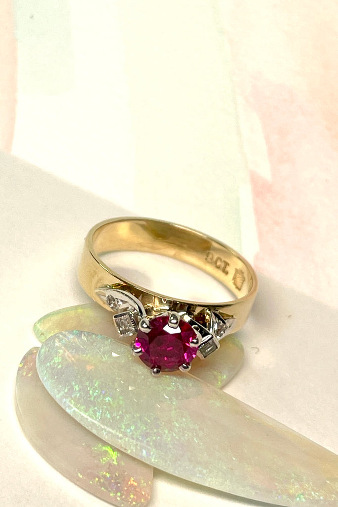 This stunning high set vintage ring features a bright Rhodolite Garnet gemstone. The band is wide and flat.  Pre worn with little signs of wear.