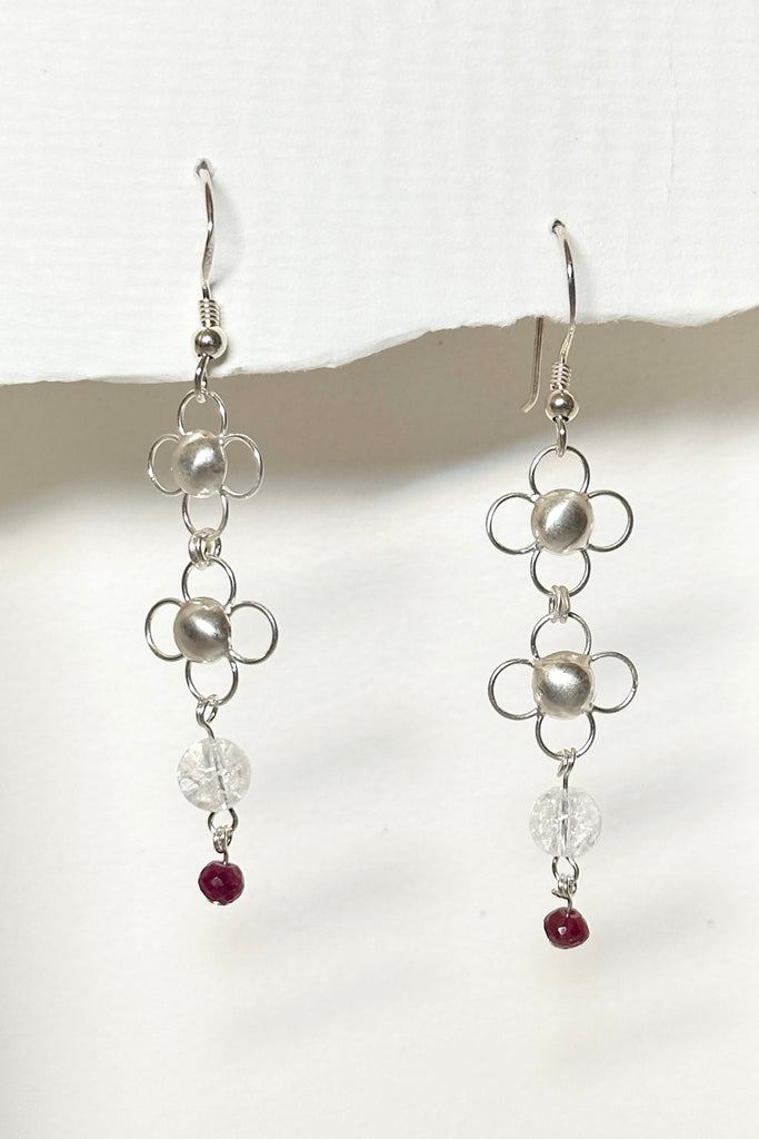 These tiny pretty and delicate 925 silver chainmaille earrings are made from lightweight squares, linked together with small rings. They are as light as a feather and beautiful to wear. There is a tiny ruby bead that swings from the bottom.