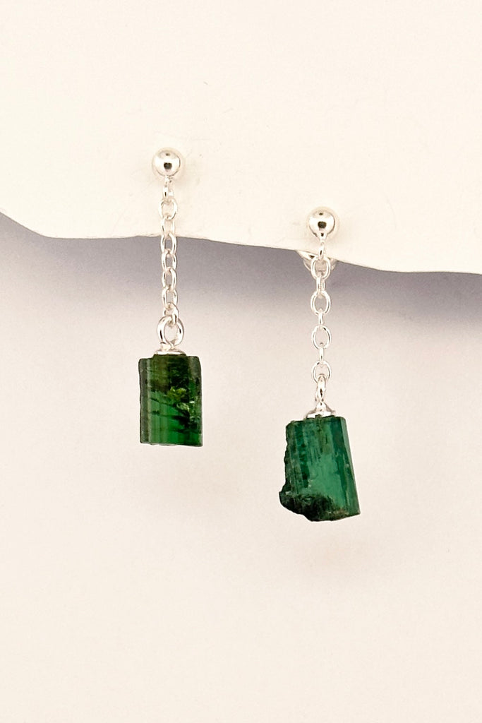 One off earrings made by hanging a natural crystal of green natural Tourmaline off a tiny chain, a very unique style, each side is slightly different.