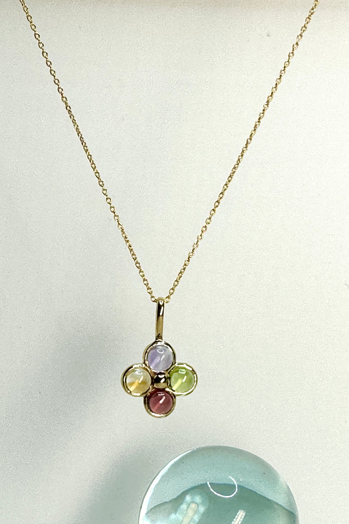 Feel the calm and the harmony of these four coloured gemstones that represent the harmony of the earth. A circle of gemstones set in 9ct gold vermeil. 