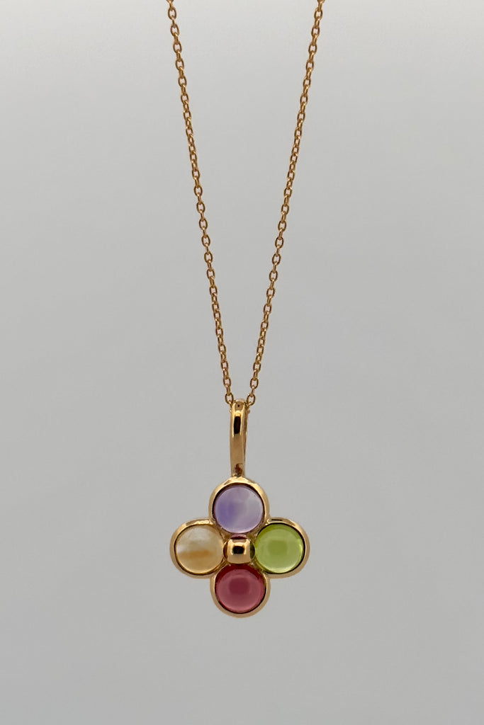 Feel the calm and the harmony of these four coloured gemstones that represent the harmony of the earth. A circle of gemstones set in 9ct gold vermeil. 