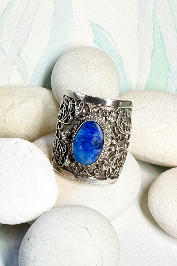 An unusual ring with a pretty cobalt blue Lapis Lazuli stone set in the centre, surrounding the stone is delicate silver filigree. The inside of the band is very smooth so it is comfortable to wear.