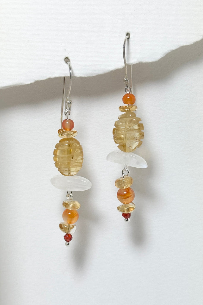 Drop style earrings statement earrings. Stones are a carved Citrine bead, natural Carnelian and Moonstone. Every stone earring will have different colour shading and intensity. Some are lighter and some have slight streaks. 