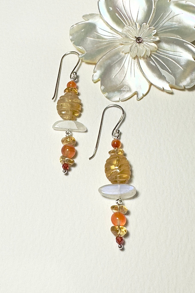 Drop style earrings statement earrings. Stones are a carved Citrine bead, natural Carnelian and Moonstone. Every stone earring will have different colour shading and intensity. Some are lighter and some have slight streaks. 