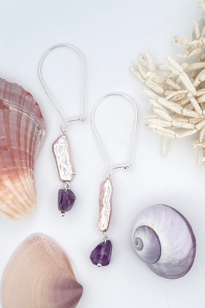 these delicate pearl and Amethyst earrings are designed to get you compliments!  A drop design, with the sparkle and style of Amethyst and the lustre of a pearl. 