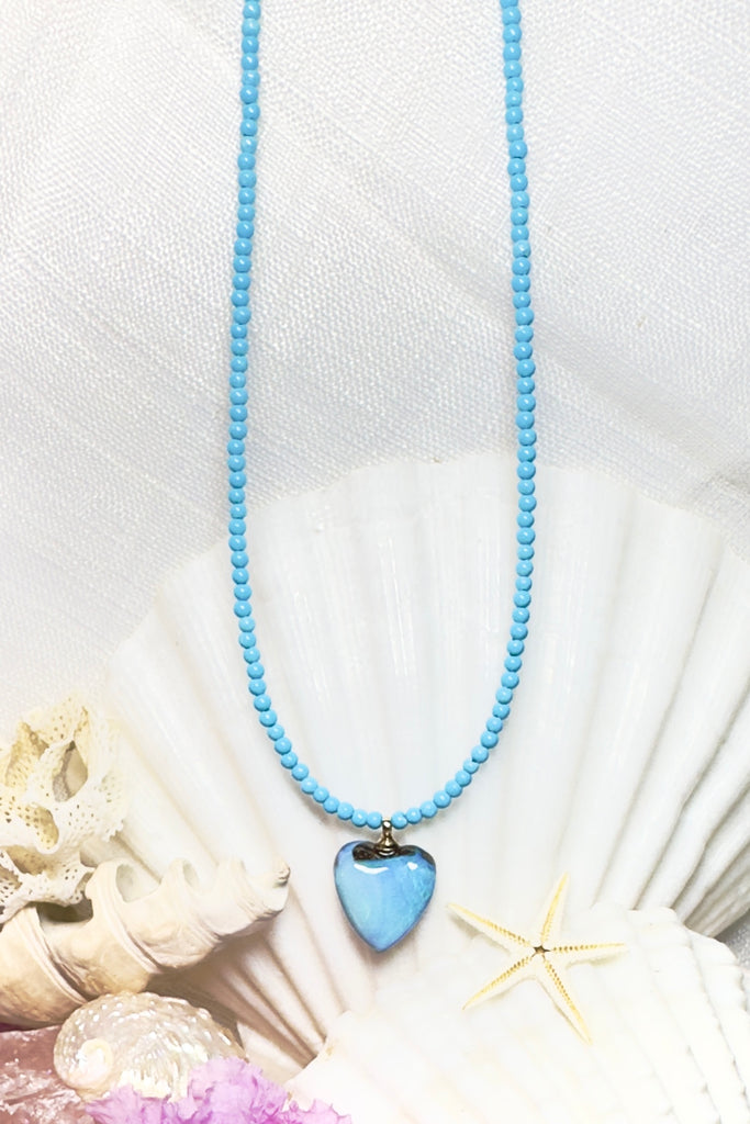 Adorable and eye catching, this pretty Australian Boulder opal heart pendant with shades blue across the surface is your summer essential.