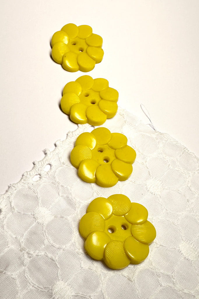 Quirky yellow buttons from the 1940,s. Great for any sewing or craft project.