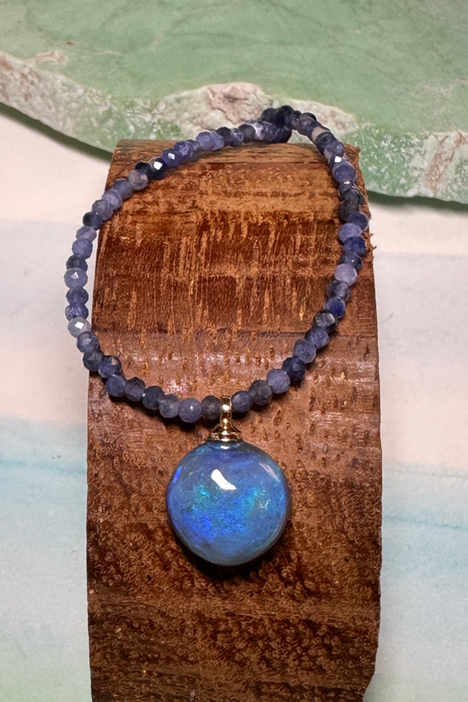 pretty blue opal pendant, its on a Sodalite&nbsp;bead gemstone necklace that sparkles in the light