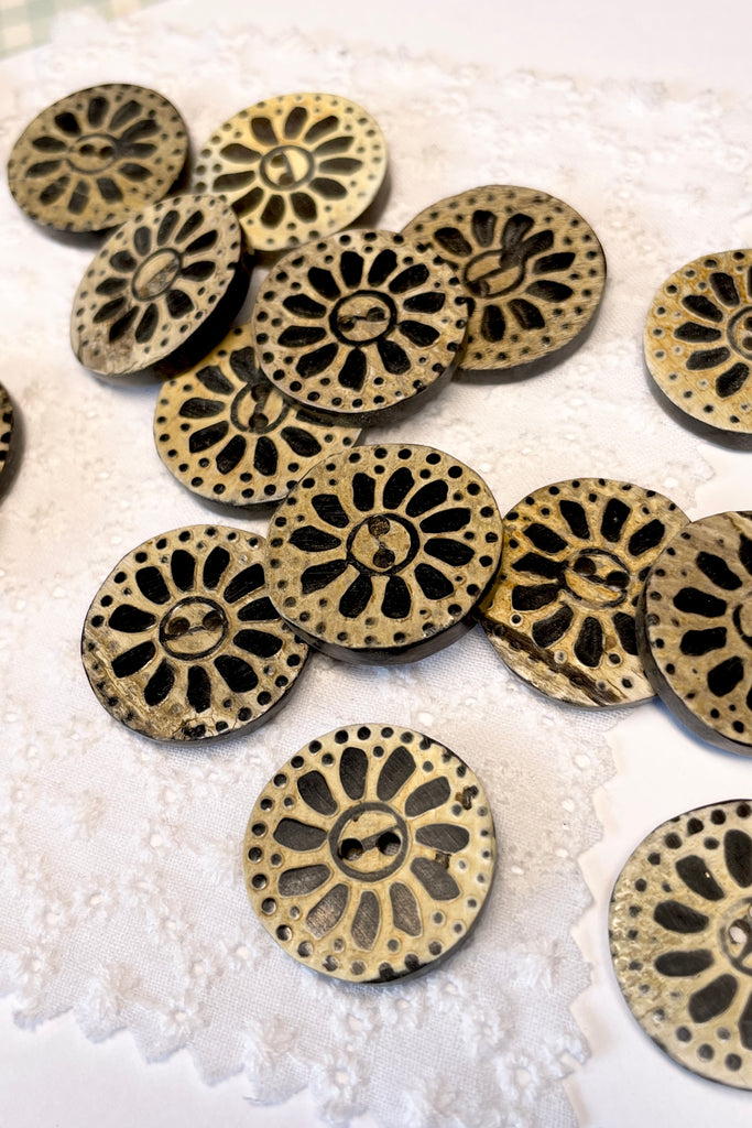 These quirky buttons are carved from horn in India, they are extremely unusual. Suitable for a jacket or skirt, every flower and button is different.