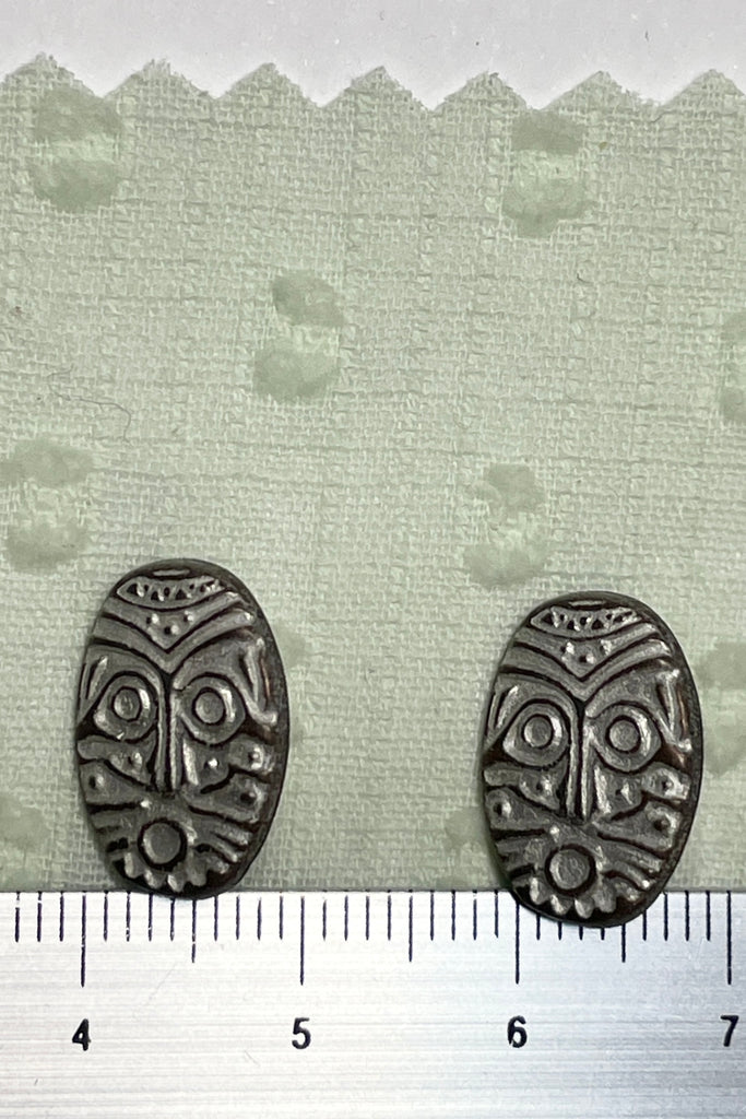 These strange little buttons are cast in metal, they are extremely unusual, They are stitched on with a shank rather than having holes.