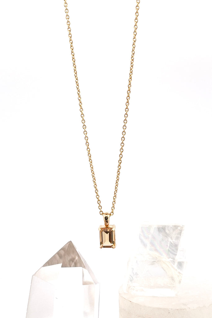The pendant and chain are 9ct gold vermeil on a base of 925 silver, the gold is 2.5microns thick so will never rub or discolor An emerald cut Citrine gemstone set in 9ct gold vermeil. Citrine gemstone. Pendant is 4cm long. Chain is gold vermeil