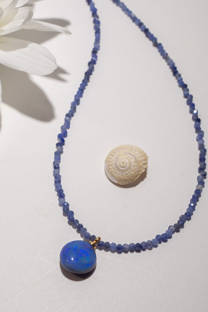Once in a blue moon you will find such a pretty blue opal pendant, its on a Sodalite&nbsp;bead gemstone necklace that sparkles in the light
