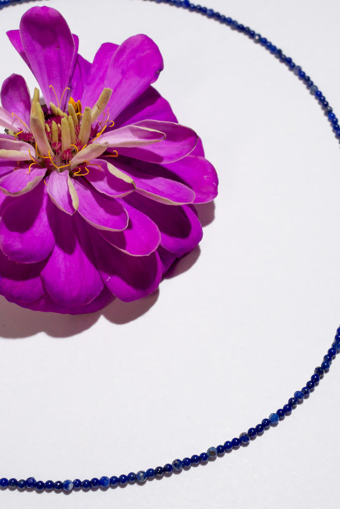 A delicate strand of deep blue lapis lazuli micro beads. This gorgeous necklace is perfect for layering or use as a chain to hang your favourite pendant on.