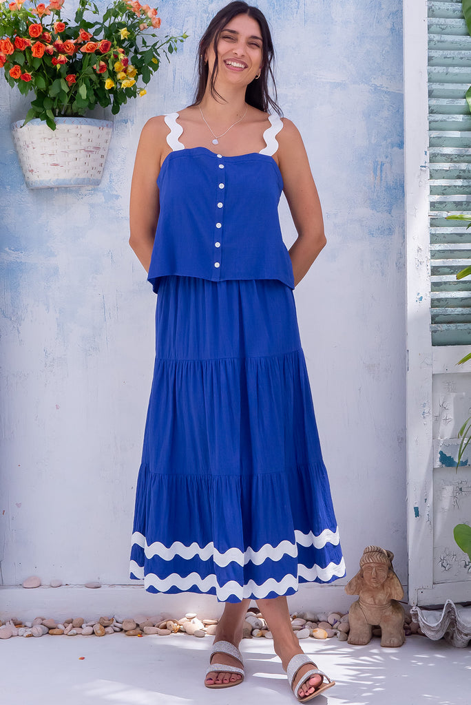 The Sorrento Ric Rac Cobalt Maxi Skirt is a beautiful blue maxi skirt with white oversized ric rac detailing on the hem. The skirt features tiering and an elasticated waistband. Made from 100% cotton.