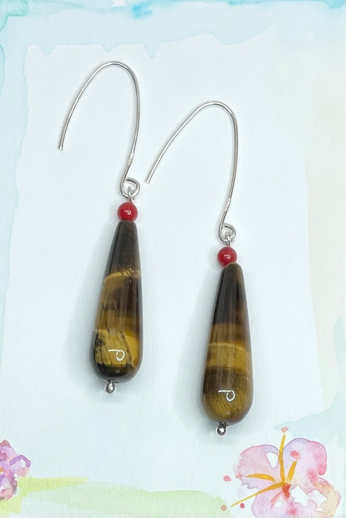 These teardrop earrings feature a golden to red-brown colour and a silky lustre, making them glisten in the sun.   