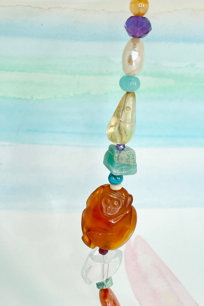 Beads are - Strawberry Quartz, Smokey Quartz, Pearl, Amazonite, Peruvian Agate, Amethyst, Carnelian, Agate, natural Sunstone, Ametrine, clear Rock Crystal, Green glass from South Africa, Natural genuine Turquoise - the centre turquoise bead is very old.