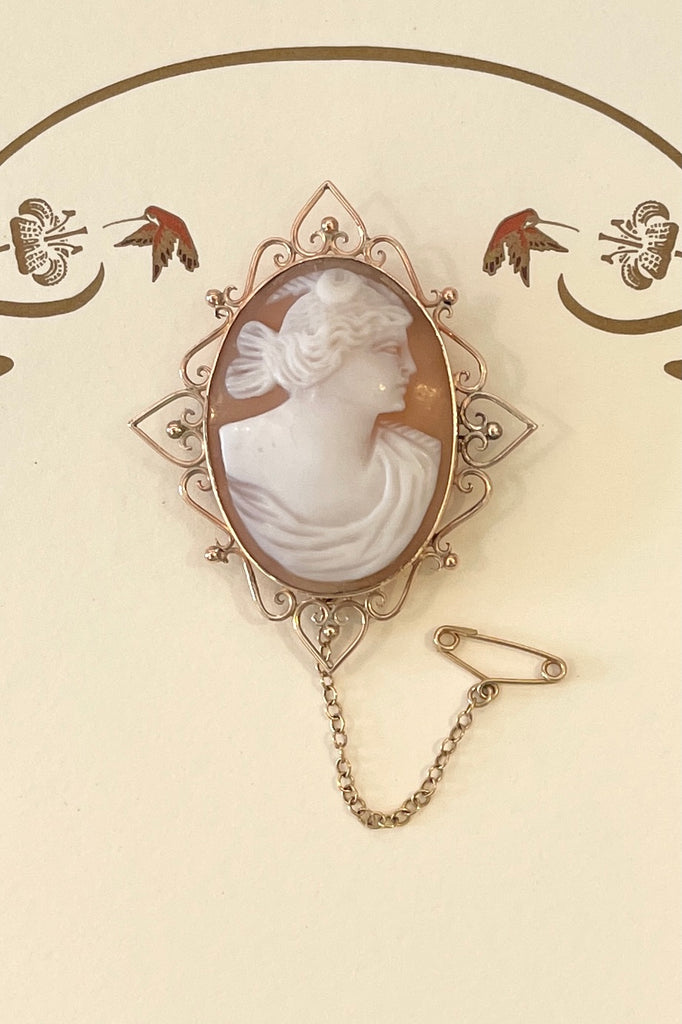  an exceptionally pretty cameo brooch, the carving is crisp and well executed, the fancy frame is really lovely. In 9ct gold