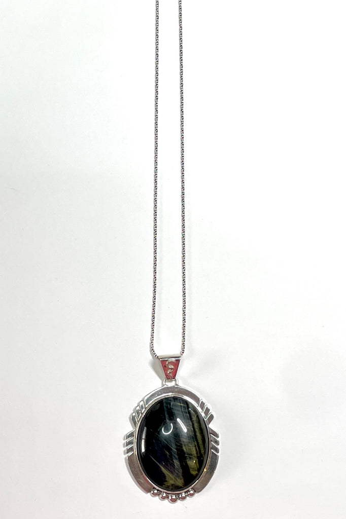 A modernist pendant in a unique design, the blue Labradorite stone was cut and faceted by a local 