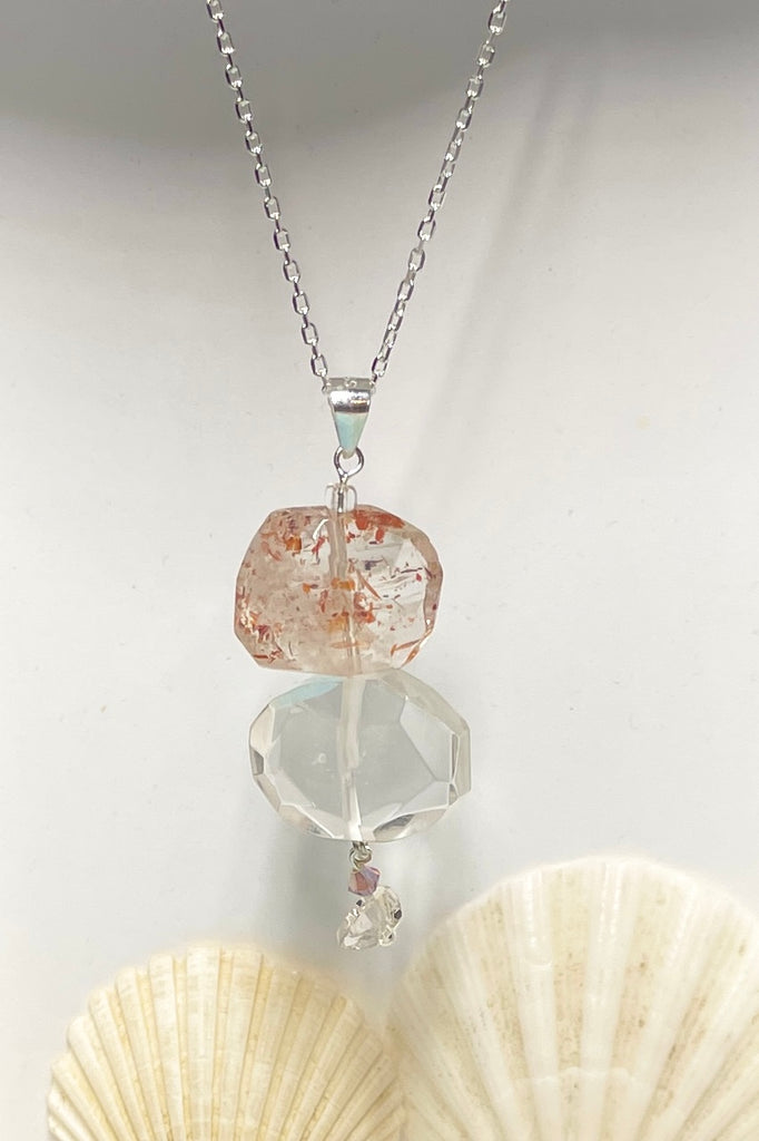 A pretty pendant of Strawberry Quartz that has been flat cut and faceted to reveal all the lovely glittery inclusions hidden inside.