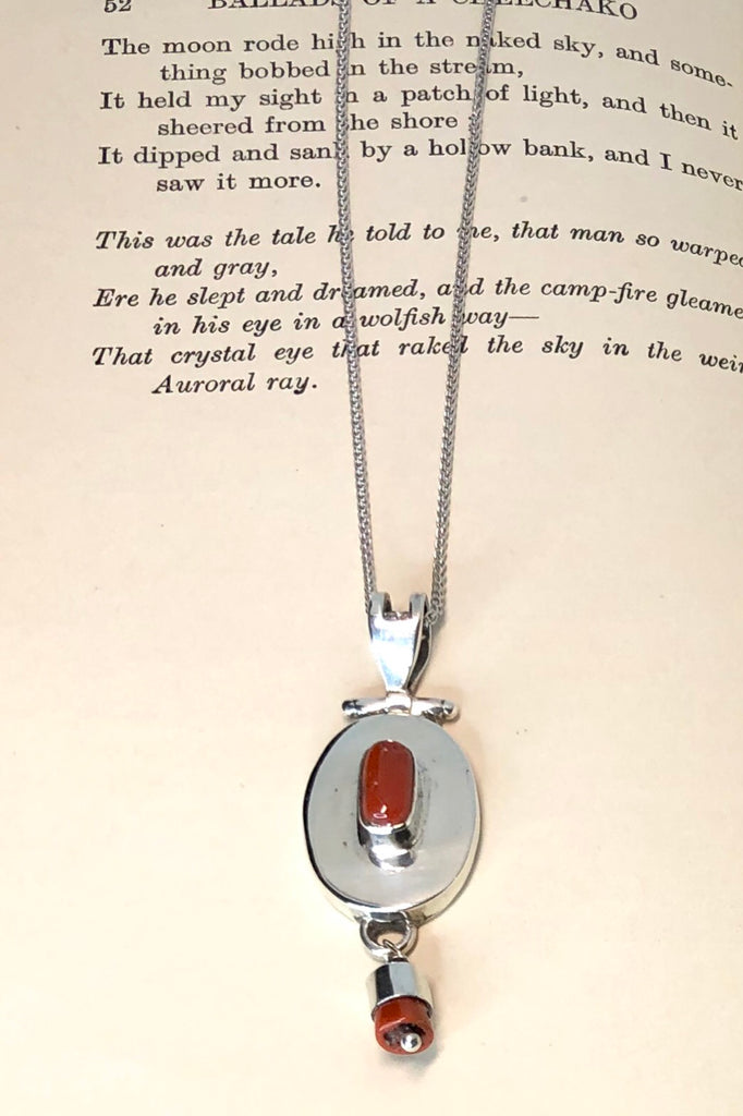 Echo Red Coral and Silver Vintage Pendant is an old piece that has a polished deep red orange coloured coral and 925 silver set pendant featuring oval design.