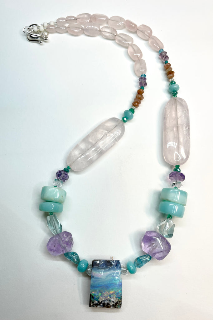This necklace is one of the first pieces showcasing the opal cutting and jewellery designs from North Shore Opals Australia.  The centrepiece is cut from an opal "split" so the surface is not polished but left exactly as it has been for millions of years.