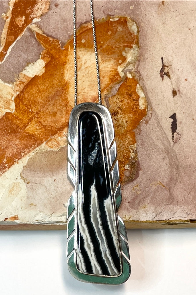  A modernist pendant in an unusual design, the amazing Zebra stone was cut and faceted by a local Sunshine Coast stone artist, he designed the unique setting 