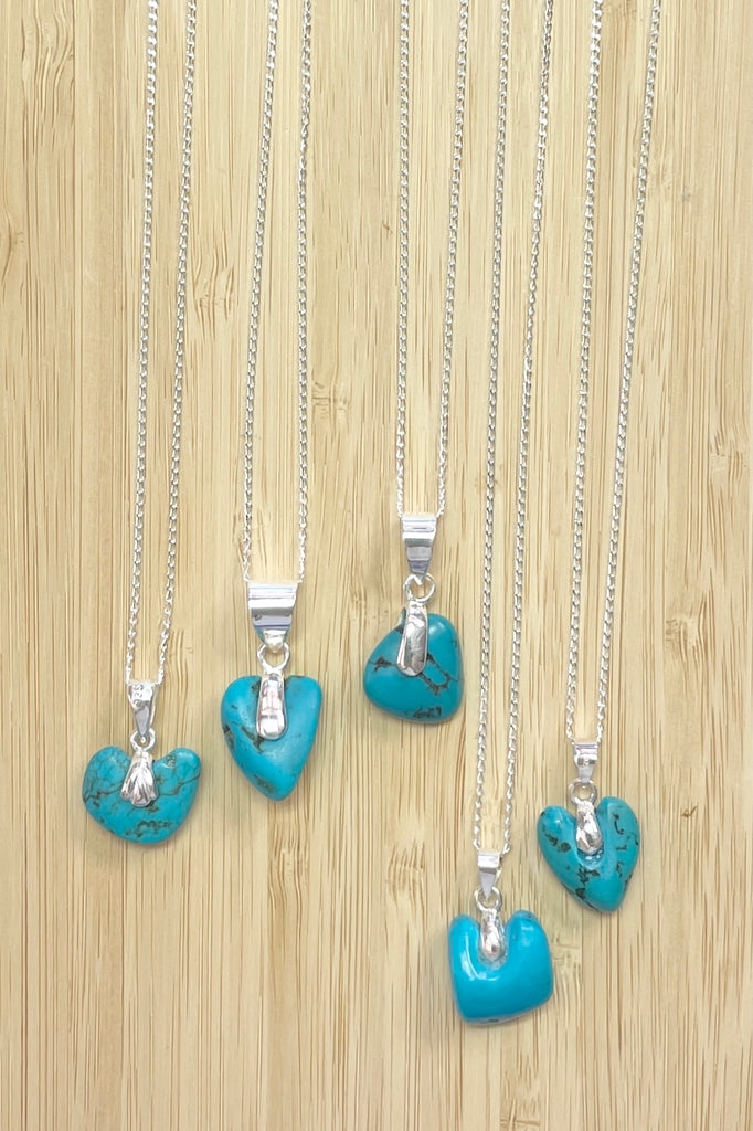 This lovely old turquoise pendant is a one off piece, hand carved into a rough heart shape