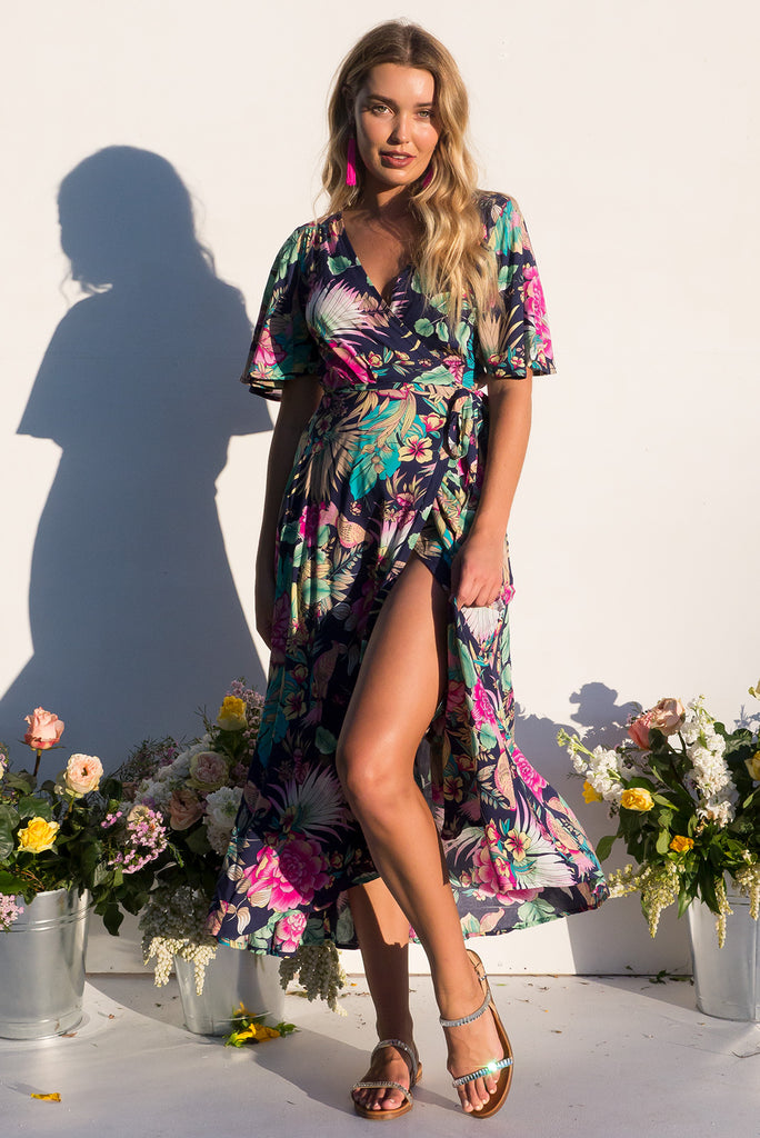 Petal Bird of Paradise Maxi Wrap dress with flutter sleeves in a vibrant navy and brightly coloured tropical print plus size dress
