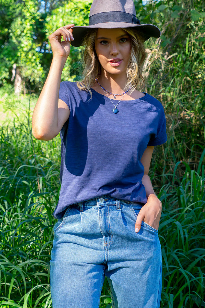 Our Classic Basic, The Phoenix Tee In A Deep Navy Blue. A Finely Woven Cotton/Poly Blend Loose Fitting T-Shirt Featuring A Curved Hem, Scooped Neck And Cap Sleeves.