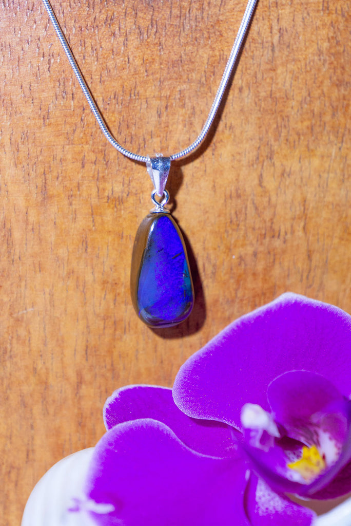 A Wonderful deep blue opal pendant, with strong blue colour, polished to a high shine on the front and back. Australian Boulder Opal.