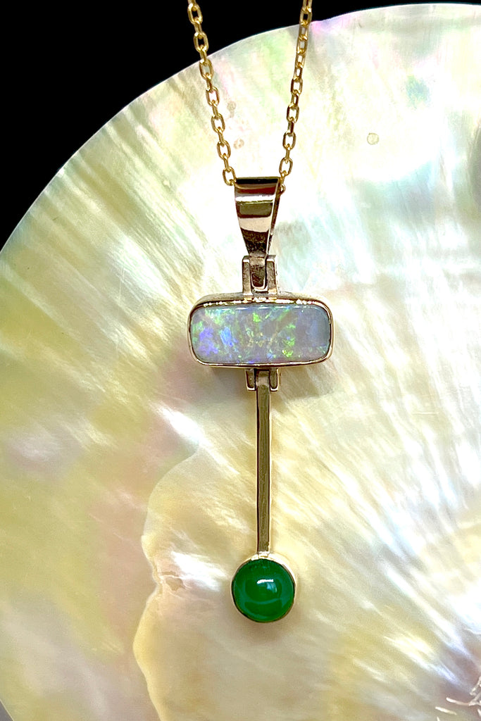 This really cool Vintage pendant features a stunning solid Australian Opal with hanging bar which has a deep green Queensland Chrysoprase cabochon detail.