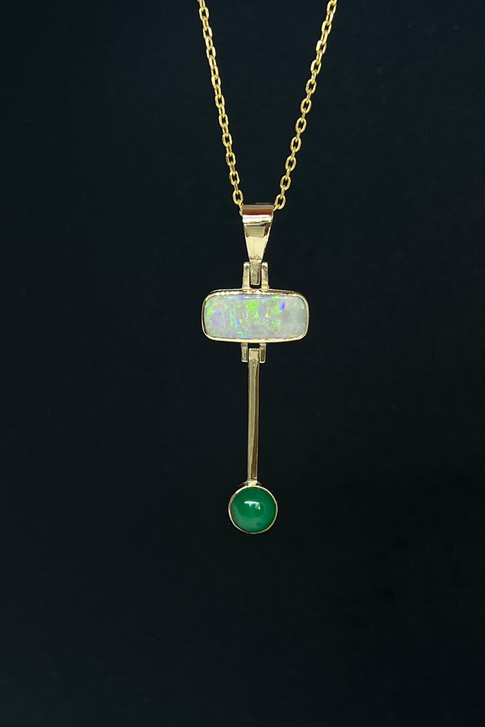 This really cool Vintage pendant features a stunning solid Australian Opal with hanging bar which has a deep green Queensland Chrysoprase cabochon detail.