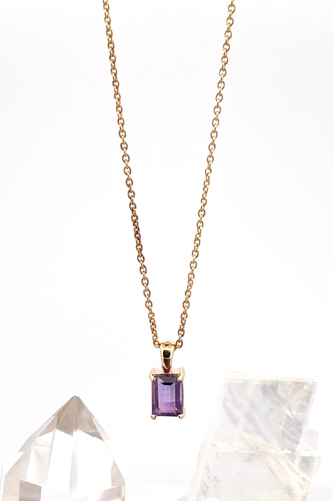 The pendant and chain are 9ct gold vermeil on a base of 925 silver, the gold is 2.5microns thick so will never rub or discolor An Amethyst emerald cut gemstone set in 9ct gold vermeil. Pendant is 4cm long. Chain is gold vermeil