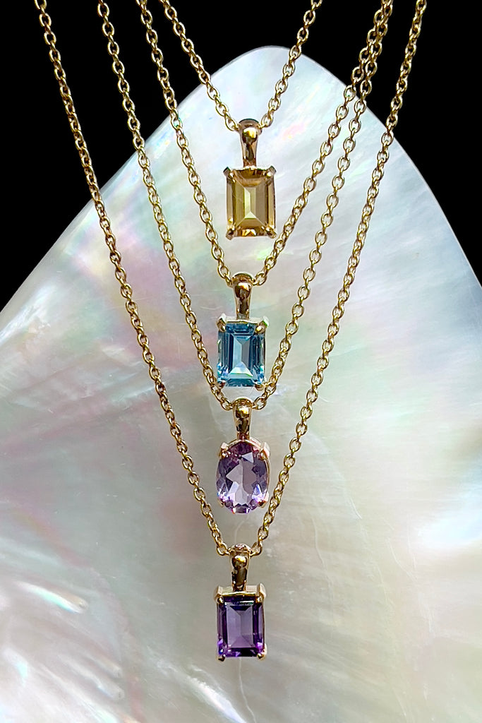 The pendant and chain are 9ct gold vermeil on a base of 925 silver, the gold is 2.5microns thick so will never rub or discolor An Amethyst emerald cut gemstone set in 9ct gold vermeil. Pendant is 4cm long. Chain is gold vermeil