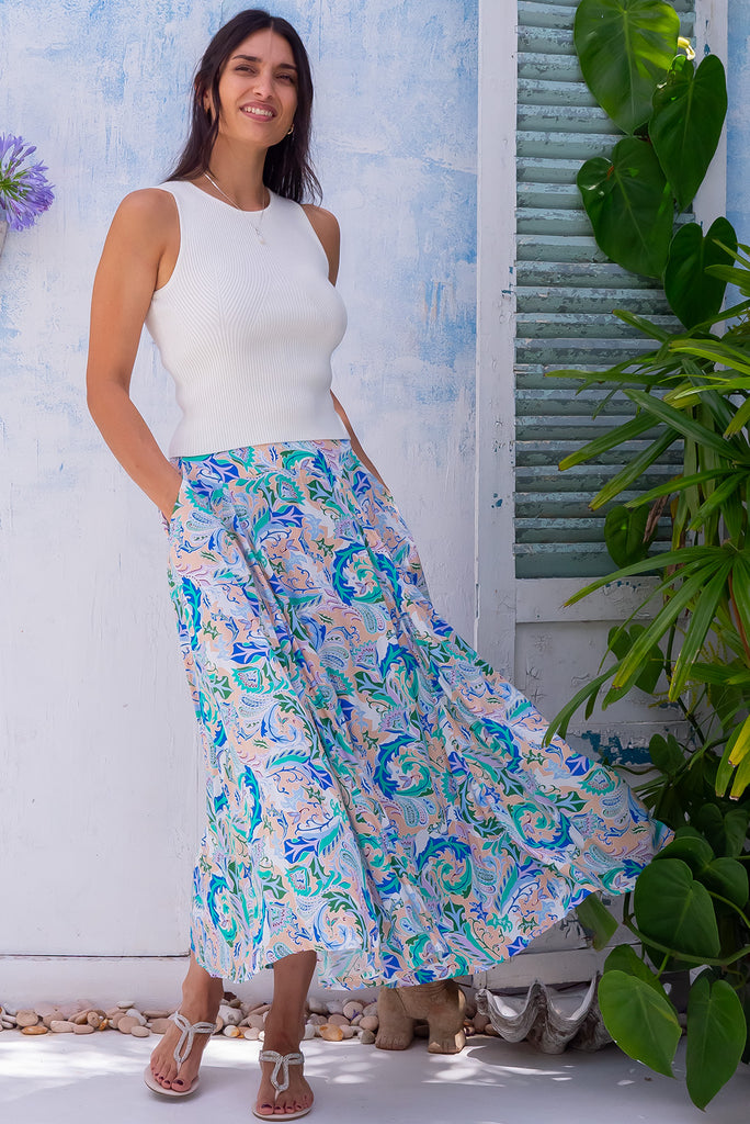 The Atlantis Sea Swirl Maxi Skirt is a beautiful cream based maxi skirt with a paisley print in blues and greens. The skirt features a double v-shaped waist yoke, inset panels on the front from the yoke down, very full skirt, elasticated back of waist and side pockets. This is a slip on design with a shapely hemline and slightly longer front due to the inset panels. Made From 100% rayon.