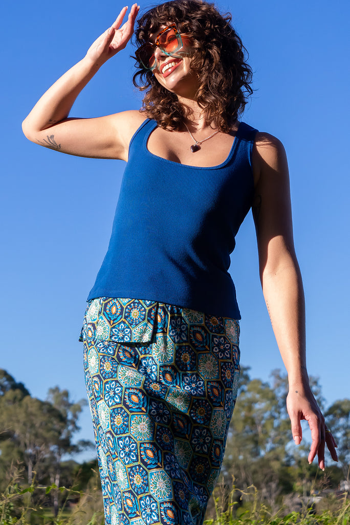 The Bianca Toledo Bias Cut Maxi Skirt is a beautiful blue skirt with a hexagonal Mexican tile print. The skirt features a bias cut, elasticated waist and belt loop with removable waist tie pocket. Made from 100% rayon.