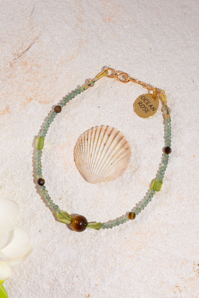 Spring has sprung with this enchanting tendril shaded gemstone bracelet.