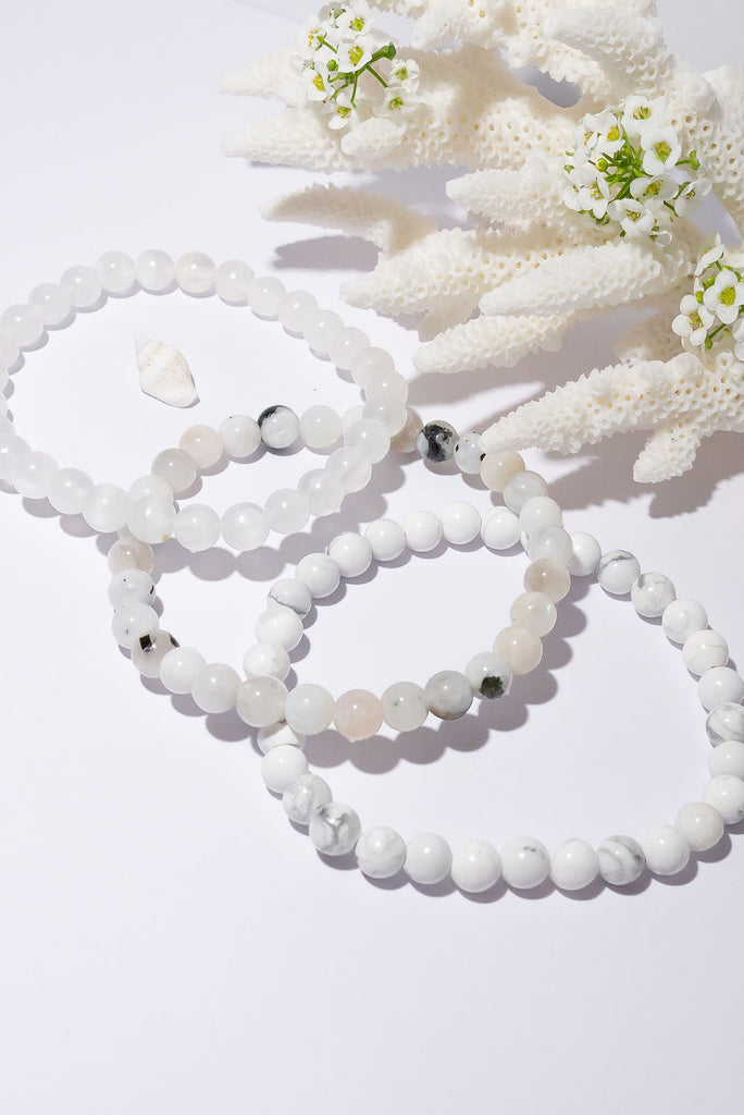 A beautiful trio of stretch bracelets in a selection of icy cool shades.