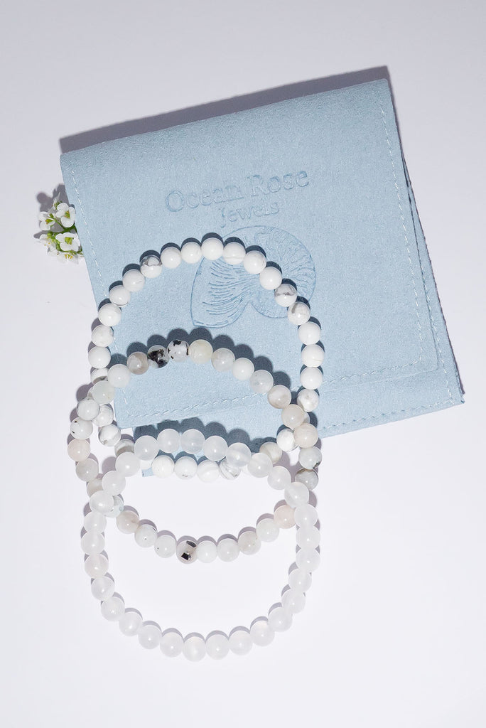 A beautiful trio of stretch bracelets in a selection of icy cool shades.