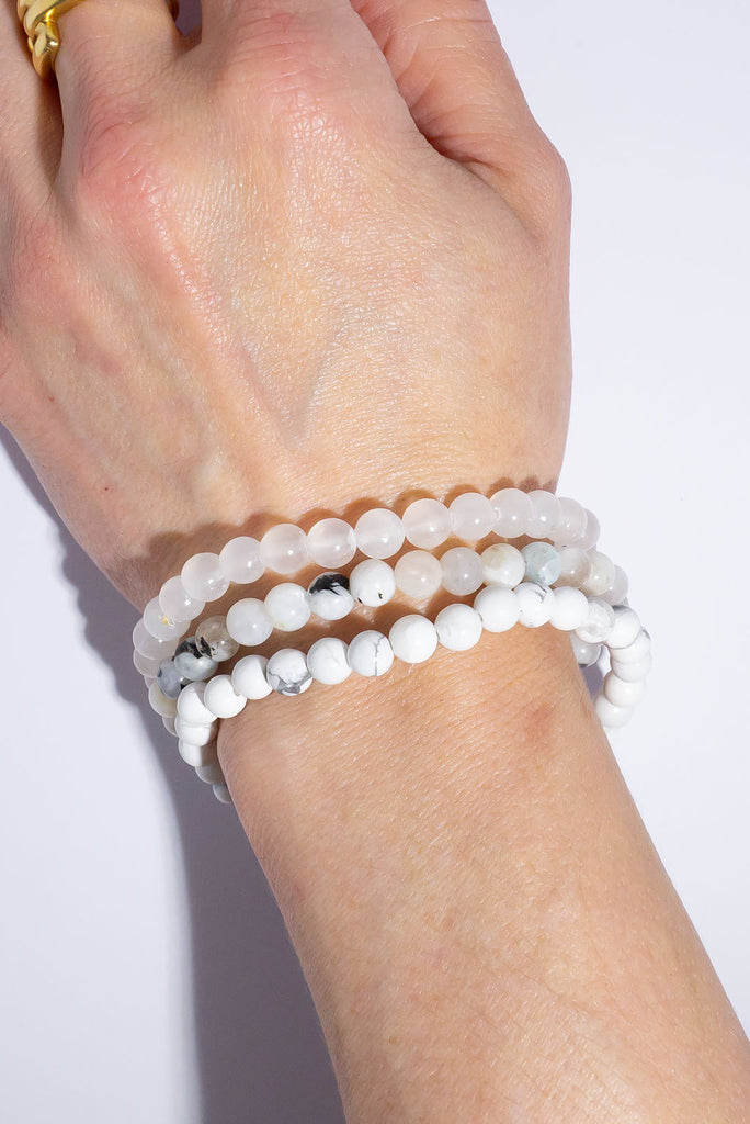 A beautiful trio of stretch bracelets in a selection of icy cool shades.