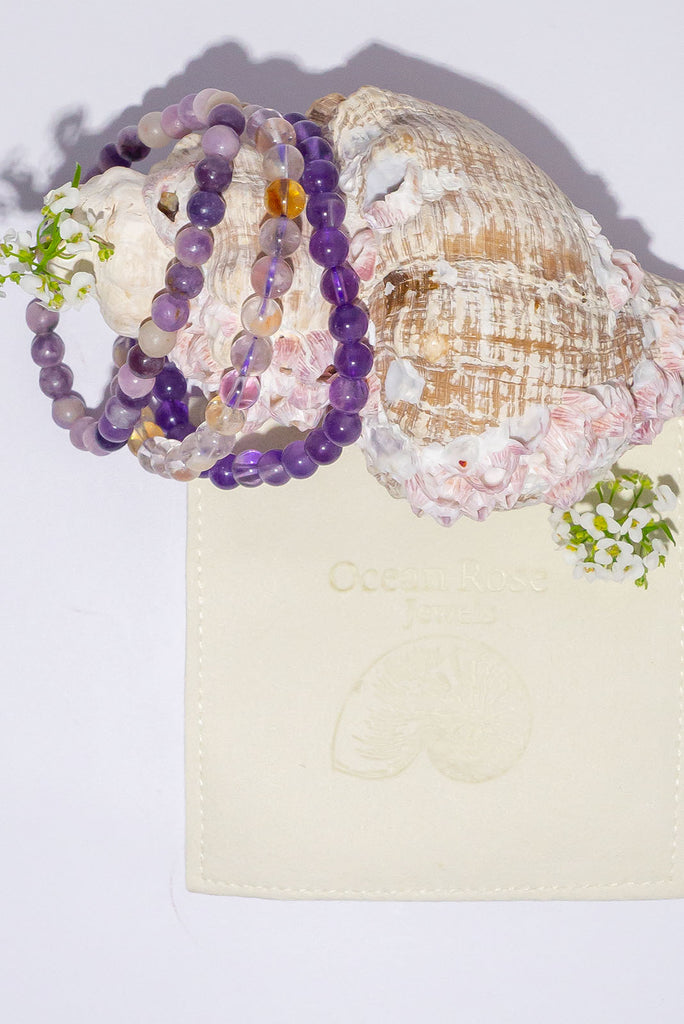 A beautiful trio of stretch bracelets in mesmerizing shades of purple.