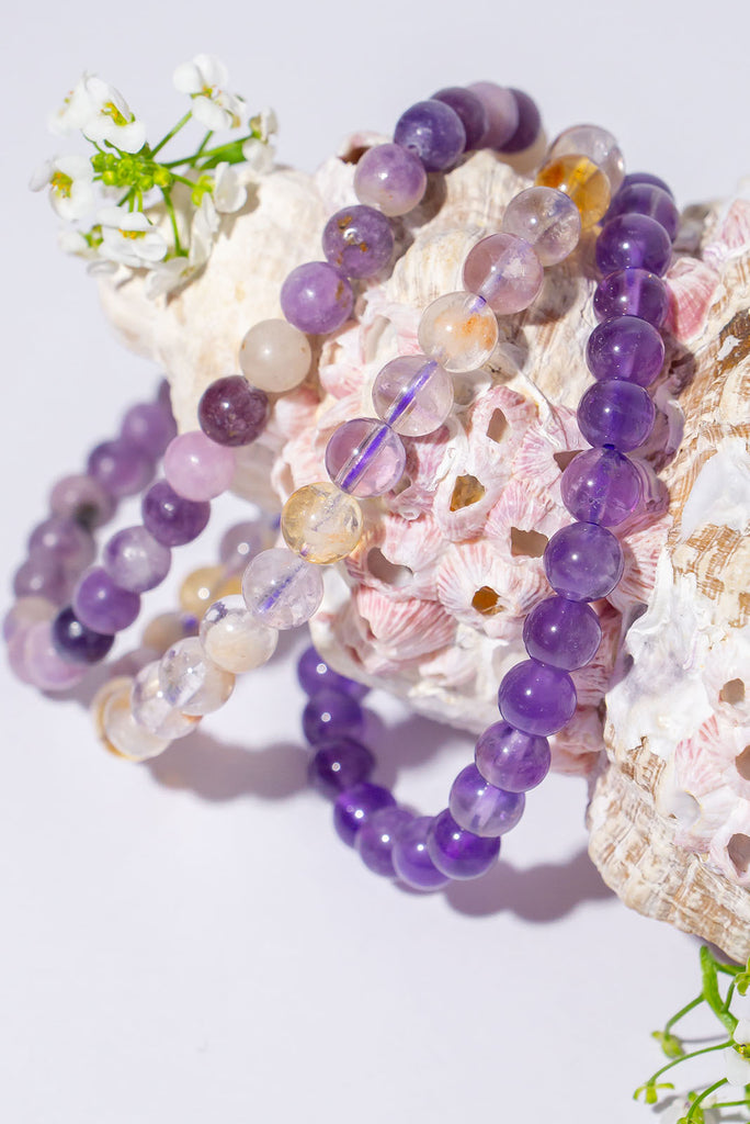 A beautiful trio of stretch bracelets in mesmerizing shades of purple.