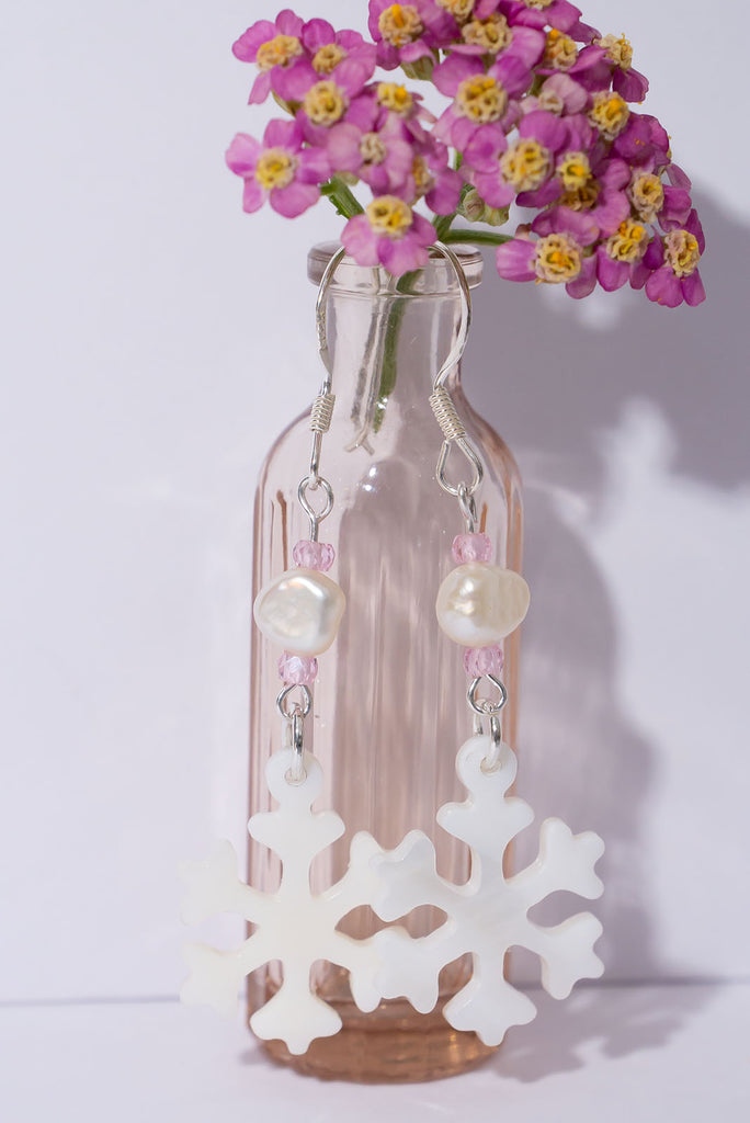 A snowflake on a South Pacific island, imagine that and this pretty carved mother of pearl snowflake has a tiny sparkling CZ bead as a highlight so dream on wearing our newest earring style.
