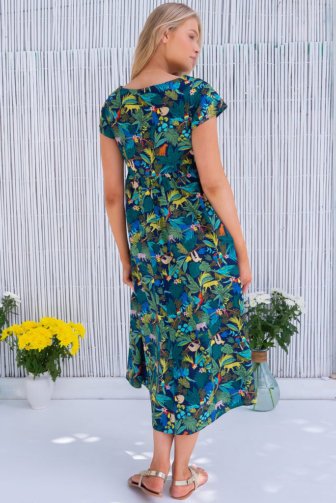 The Cocoloco Jungle Dress is a gorgeous navy based midi dress with a tropical jungle print. The dress features short sleeves, pockets, and is made from woven 100% cotton. 