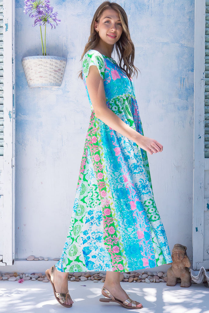 The Cocoloco Seashine Dress is a gorgeous green, blue and pink bohemian patch printed midi dress. The dress features short sleeves, pockets, and is made from woven 100% cotton. 